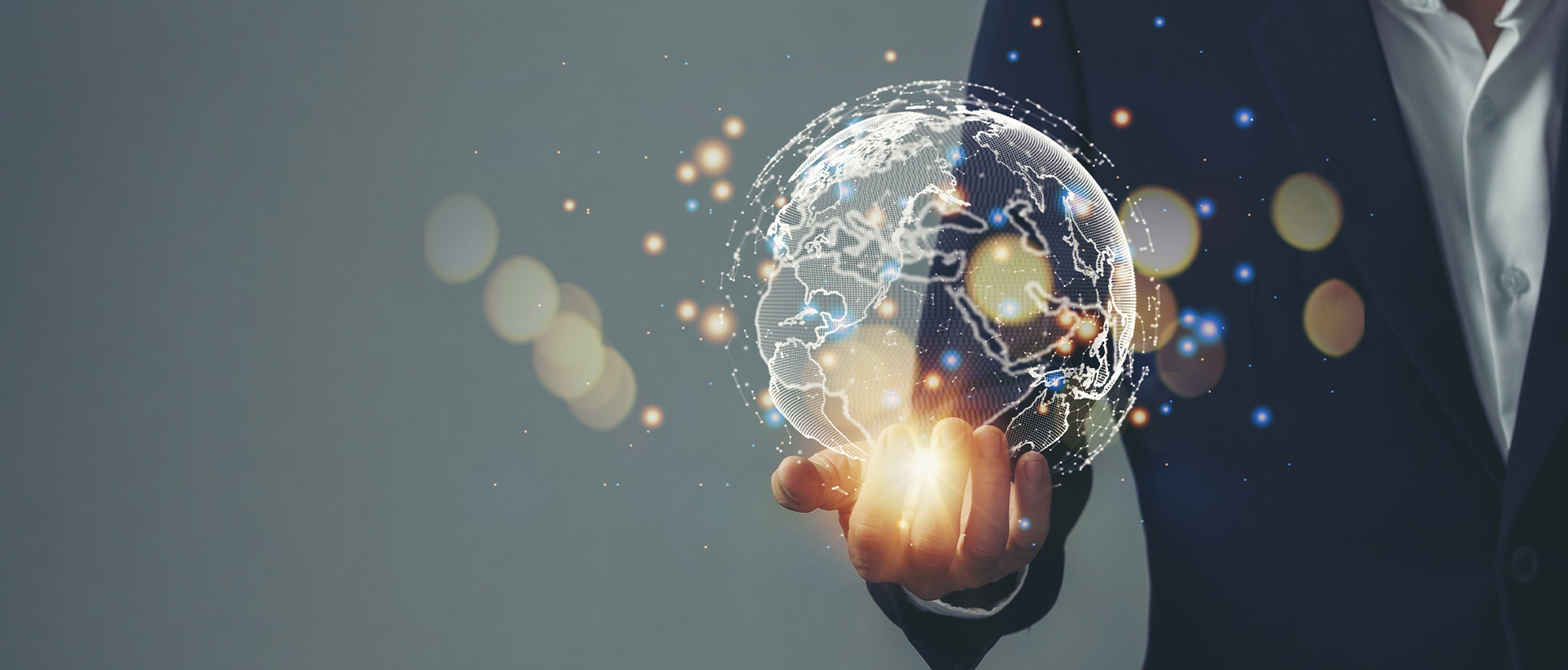 Hand holding a globe